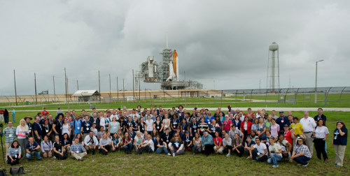 STS-135 space tweeps in front of Atlantis on Launchpad